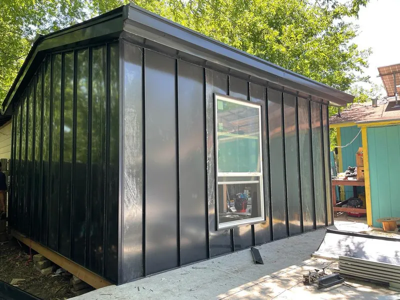 Black standing seam metal wall panels for Roof Inspection in Pleasant Run