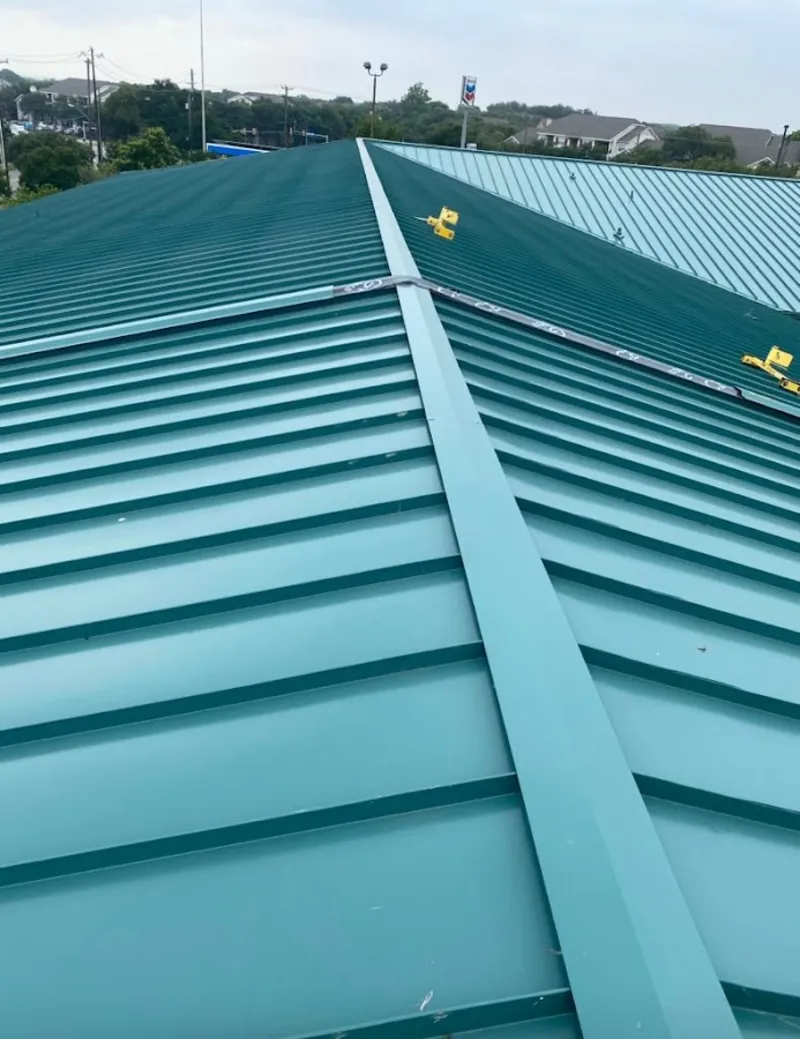 Green commercial metal roof ridge and valley for Metal Roof Repair in Pleasant Run